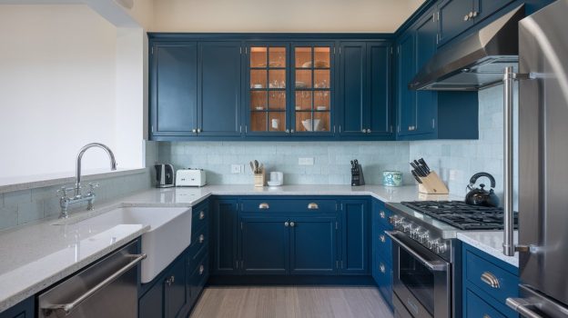 A kitchen with blue cabinets and white counter tops - Royal Sapphire Elegance