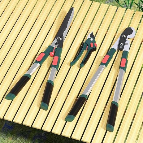 A pair of scissors and secateurs on a wooden surface  Description automatically generated