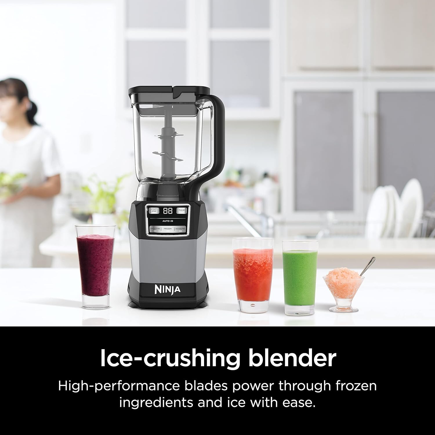A blender and glasses of smoothies  Description automatically generated
