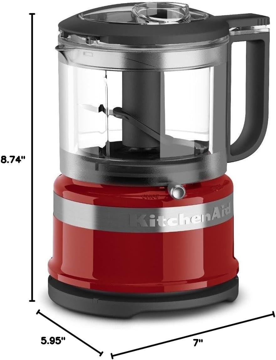 A red and silver food processor  Description automatically generated