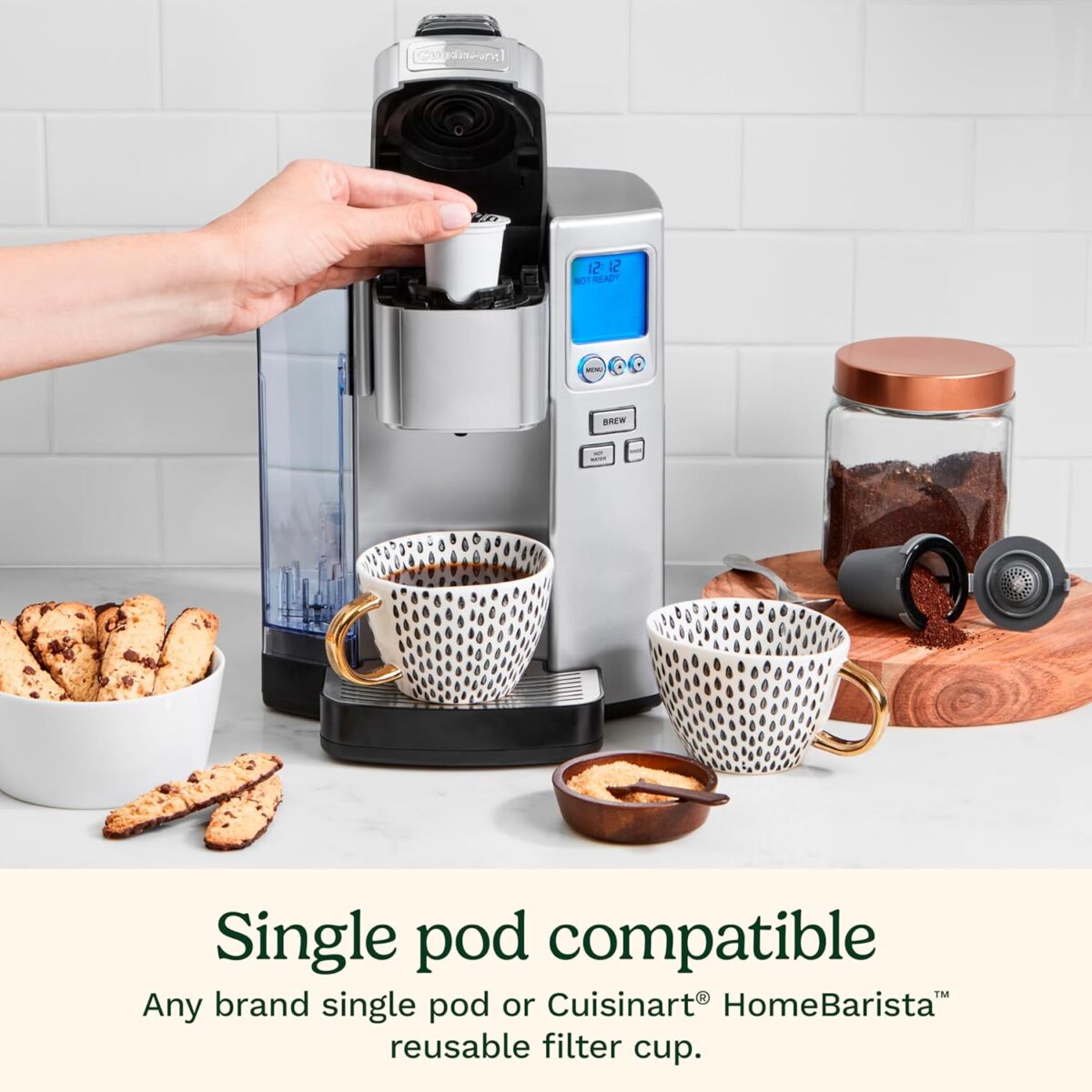 A hand pouring a cup of coffee into a coffee machine  Description automatically generated