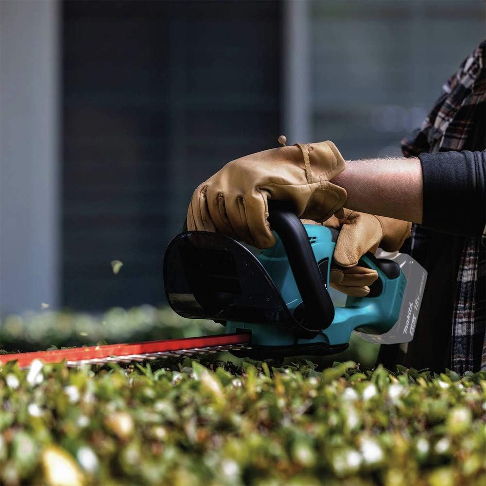 A person using a power tool  Description automatically generated