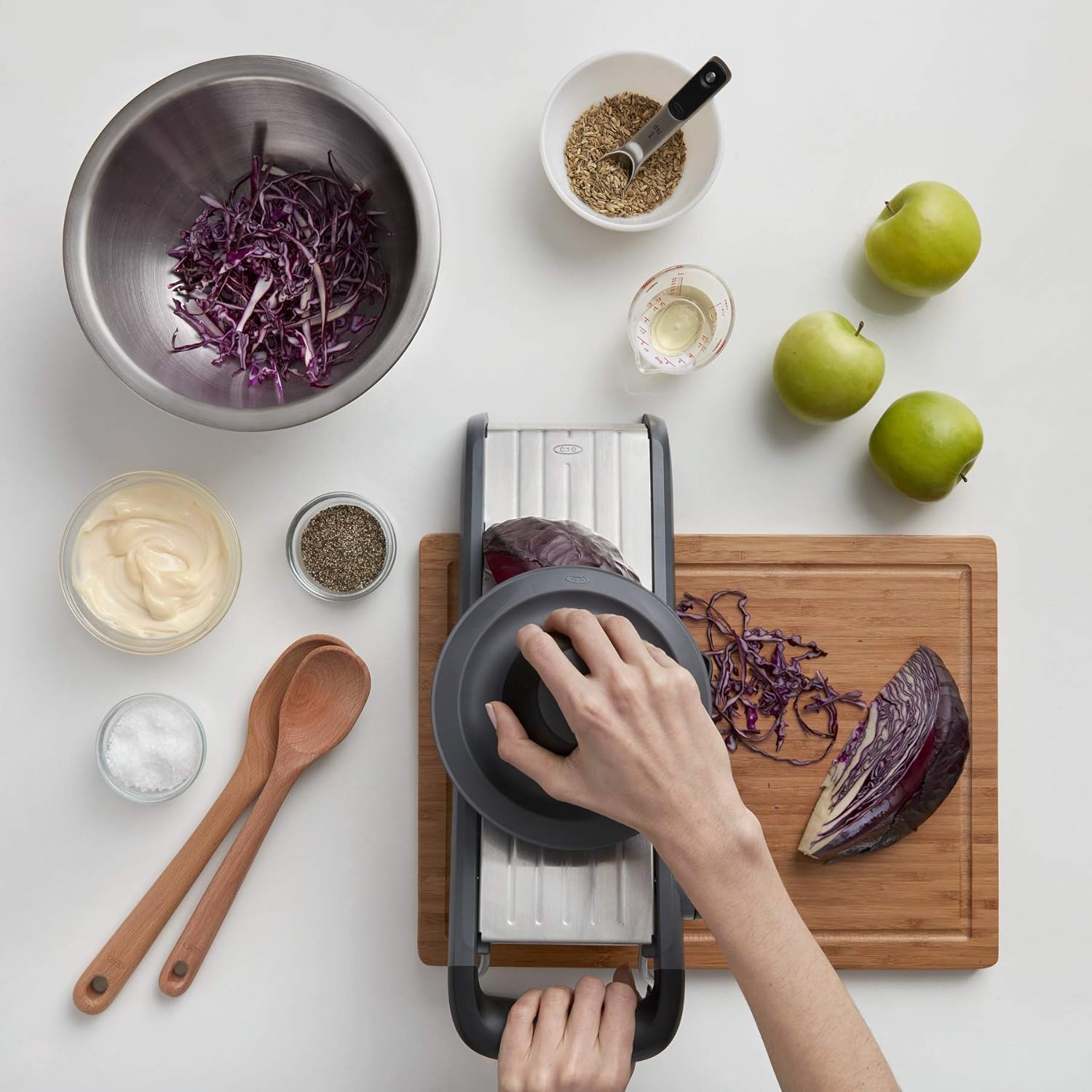 A person using a vegetable cutter  Description automatically generated