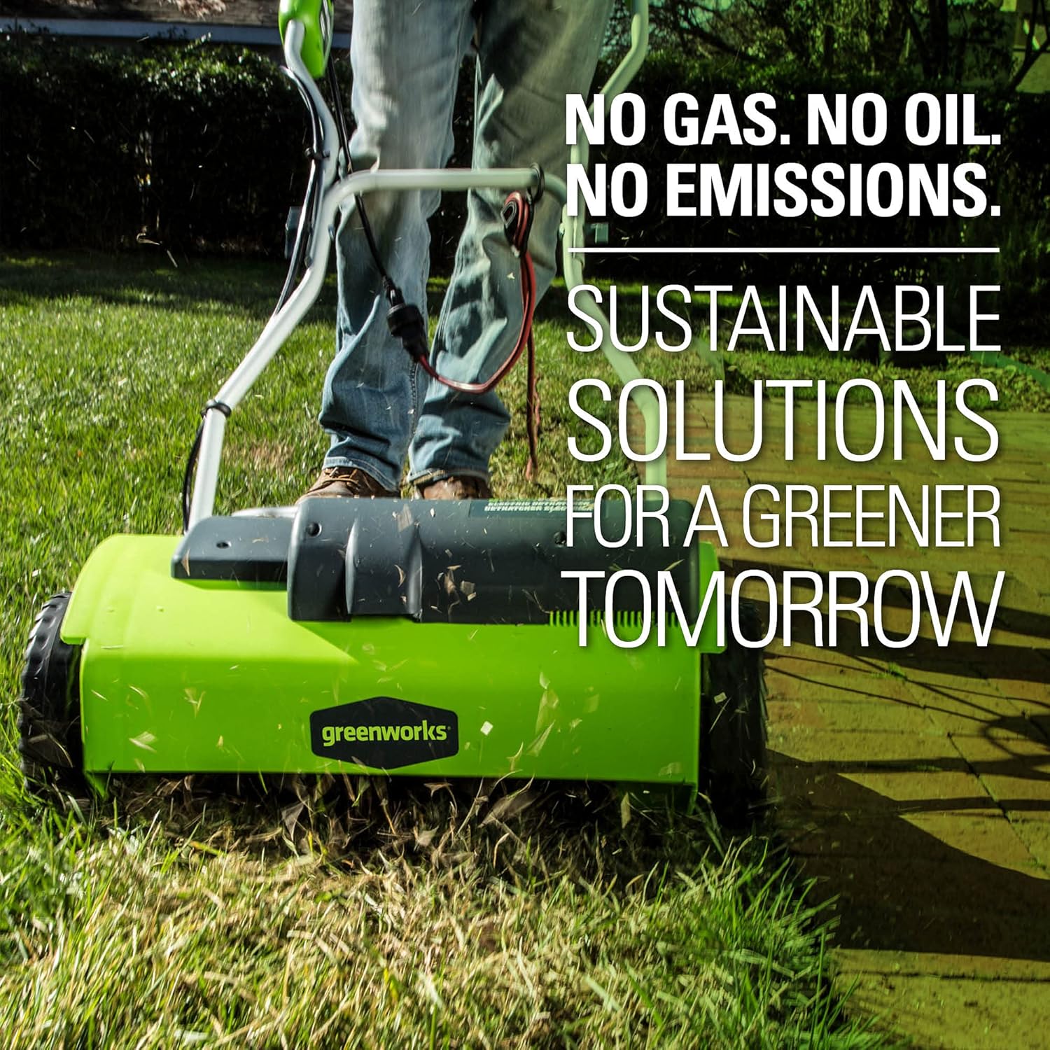 Greenworks 10 Amp 14” Corded Electric Dethatcher Review 10 A green lawnmower on a lawn - Greenworks 10 Amp 14” Corded Electric Dethatcher (Stainless Steel Tines)