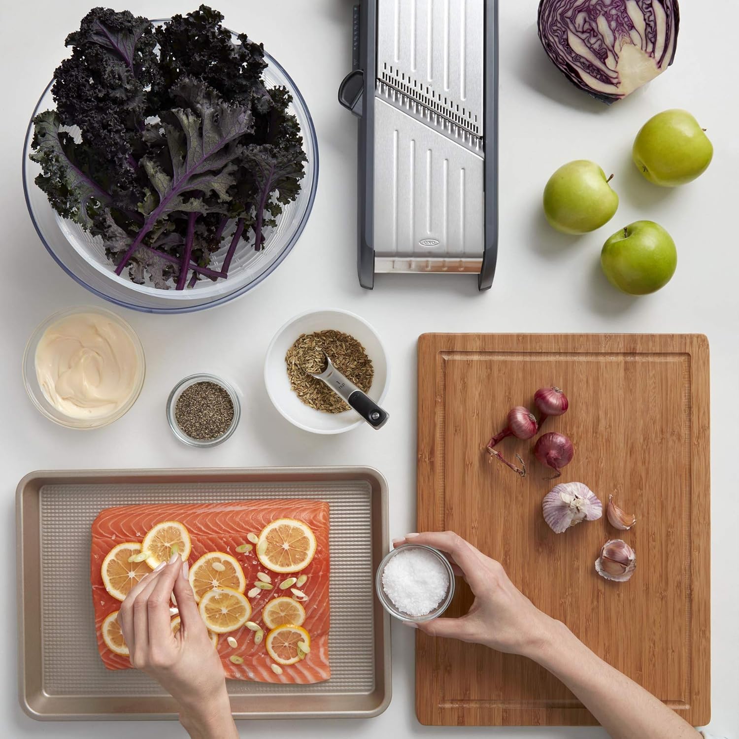 A person preparing food on a table  Description automatically generated
